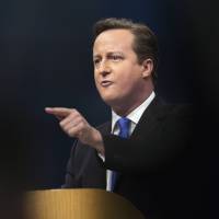 It’s not easy being green: British Prime Minister David Cameron, leader of the Conservative Party, speaks at the party’s annual conference in Manchester, England. Environmentalists say Cameron’s pledge to lead a new era of the “green Conservative” is in danger of melting away In Britain, era of 'green Tory' withers
