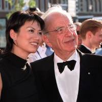 Should have known: Media magnate Rupert Murdoch and his wife, Wendi Deng, who recently agreed on a divorce settlement, arrive for the official opening of Fox Studios Australia in Sydney in November 1999. | AFP-JIJI