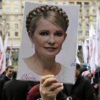 Not forgotten: A supporter of former Ukrainian Prime Minister Yulia Tymoshenko attends a protest outside the Kiev City Council building in October. Ukraine puts brakes on historic EU deal