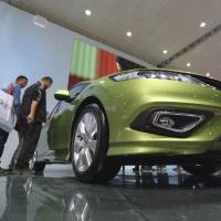 A gem: Visitors view a Honda Jade at the booth of Dongfeng Honda Automobile Co. the joint venture between Dongfeng Motor Corp. and Honda Motor Co., at the Wuhan Motor Show 2013 in Wuhan, central China, on Oct. 19 | BLOOMBERG