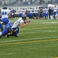 Reaching out: Panasonic backup quarterback Yuma Nakashima  extends his arms to get in the end zone for a 3-yard rushing touchdown  in the fourth quarter of an X League game on Saturday. Panasonic defeated IBM 55-24. | HIROSHI IKEZAWA