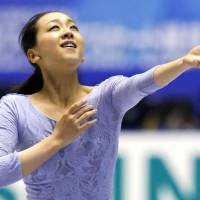 Finishing touch: Mao Asada practices for the NHK Trophy on Thursday. | KYODO