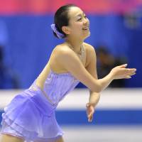 Joyful performance: Mao Asada skates during the women\'s short program at the NHK Trophy on Friday at Yoyogi National Gymnasium. Mao sits in first place with 71.26 points. | AFP-JIJI