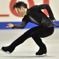 In control: Daisuke Takahashi performs during the men\'s short program at the NHK Trophy on Friday at Yoyogi National Gymnasium. Takahashi leads the field with 95.55 points. | AFP-JIJI