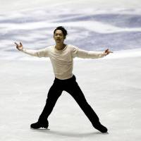 Twist and shout: Daisuke Takahashi performs his free-skate routine en route to overall victory at the NHK Trophy on Saturday. | AP