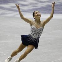 Bronze age: Akiko Suzuki performs on her way to a third-place finish at the NHK Trophy on Saturday. | AP