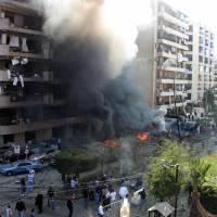 Inflamed tensions: Flames rise from the site of two blasts in Beirut on Tuesday. At least 23 people were killed in the bombings outside the Iranian Embassy in Lebanon\'s capital, including cultural advisor from Tehran, government sources said | AFP-JIJI