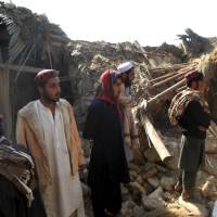 Hard lesson: Pakistani Islamic students gather at a site belonging to the Haqqani militant network after a U.S. drone strike in the Hangu district of Khyber Pakhtunkhwa province on Thursday. | AFP-JIJI