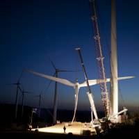 Out of fin air: Workers in Caetite, Brazil, prepare blades to be hoisted onto a tower at the High Wilderness Wind Complex, a project of more than 400 wind turbines run by Renova Energia, a Sao Paulo energy company, on Oct. 25 'Perfect' winds give Brazil another option for power