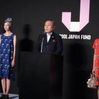 Thinking globally: Cool Japan Fund CEO Nobuyuki Ota speaks at the launch ceremony Monday in Tokyo for the public- and private-funded entity that will promote Japanese products overseas. | KAZUAKI NAGATA