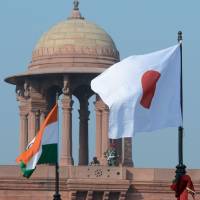 Welcoming sign: The Japanese and Indian flags fly in front of the Indian Secretariat on Rajpath in New Delhi on Saturday, ahead of a state visit by Emperor Akihito and Empress Michiko. The Imperial Couple arrived in the city Saturday for a six-day visit. | AFP-JIJI