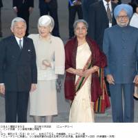 At ease: Emperor Akihito and Empress Michiko pose for a photo in New Delhi with Indian Prime Minister Manmohan Singh and his wife, Gursharan Kaur, after arriving for an official state visit Saturday. | POOL