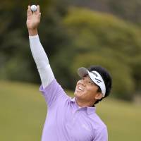 Big win: China\'s Wu Ashun gestures in triumph after finishing the final round to win the Heiwa PGM Championship Sunday in Miho, Ibaraki Prefecture | KYODO