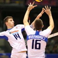 Like clockwork: Italy\'s Michele Baranowicz sets the ball for teammate Matteo Piano during Saturday\'s FIVB Men\'s Grand Champions Cup match against Japan at Tokyo Metropolitan Gymnasium. Italy defeated Japan in three straight sets. | FIVB
