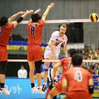 Finding a way: Italy\'s Ivan Zaytsev hits a spike past Japan\'s defense on Saturday. | FIVB