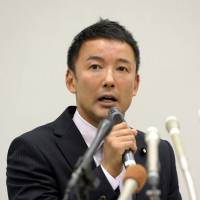 Hot seat: Upper House lawmaker Taro Yamamoto faces the media Tuesday in Tokyo to answer questions on why he broke with protocol and gave a letter to Emperor Akihito last week | KYODO