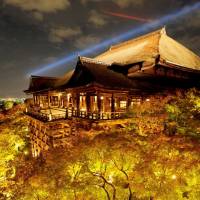 With fall colors at their peak, Kiyomizu Temple, a famous tourist attraction in the city of Kyoto, is set aglow Thursday night. The illuminations will run through Dec. 8. | KYODO