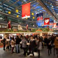 Decked out for Christmas: Shoppers browse through the German Christmas Market at Tokyo\'s Roppongi Hill complex. | AP