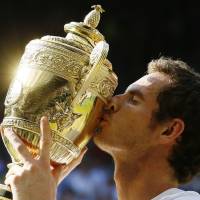 It was worth the wait: Andy Murray kisses the winner’s trophy after becoming the first British man in 77 years to win Wimbledon.  | AP
