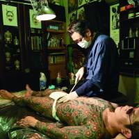 Pain and ink: Horimitsu in his studio at work on a full-body tattoo. | IRWIN WONG