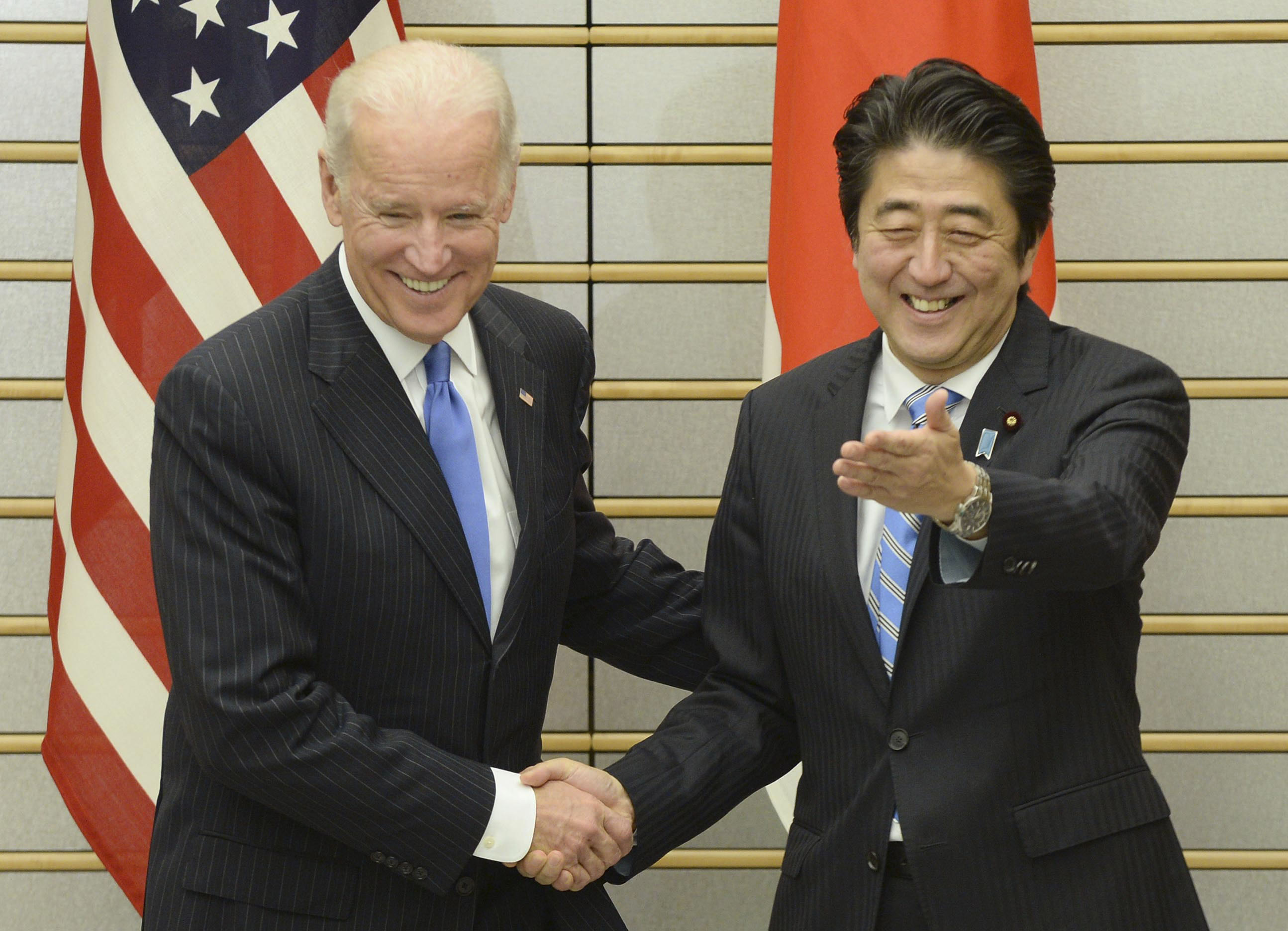 In the zone: U.S. Vice President Joe Biden is welcomed by Prime Minister Shinzo Abe at the prime minister's office Tuesday. | AP/POOL