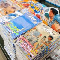 Best-seller: Copies of the popular comic book series \"Kuroko no Basuke\" (\"The Basketball which Kuroko Plays\") by Tadatoshi Fujimaki are seen in a Tokyo bookstore in November. | KYODO