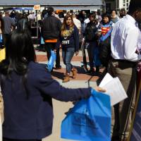 Getting ready for real life: Students attend a hiring event in Los Angeles. Some parents have become over-involved in their kids\' problems, even after they\'ve left home &#8212; a trend that Carolyn O\'Laughlin, director of residence life at Sarah Lawrence College, New York, says could leave kids unprepared for the future. | BLOOMBERG