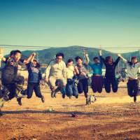 Jump for  Tohoku:  Yeonha Seo (second left, pointing) with Japanese and international student volunteers in Ishinomaki, Miyagi Prefecture, in October 2011. | KIZUNA INTERNATIONAL