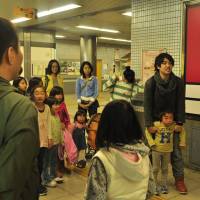 Taking the initiative:  Tonghwi Soh (right) supervises an excursion with young  Tohoku evacuees in Kyoto in 2012. | KIZUNA FROM KYOTO