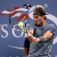Return to sender: Rafael Nadal hits a return against No. 1 Novak Djokovic during the U.S. Open final. Nadal bounced back from an injury-plagued 2012 by winning a pair of Grand Slam events, including his 6-2, 3-6, 6-4, 6-1 victory over Djokovic in September. | AFP-JIJI