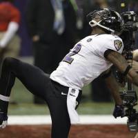 The Baltimore Ravens’ Jacoby Jones celebrates after his 108-yard kickoff return to start the second half of Super Bowl XLVII.  The Ravens limped into the playoffs, but put things together in time to win the title. | AP