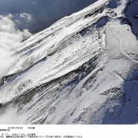Fatal fall: Two alpinists fell to their deaths Sunday from near the summit of snowbound Mount Fuji and two others who fell with them are hospitalized.   | KYODO