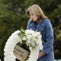 Inaugural visit: U.S. Ambassador Caroline Kennedy places a wreath in front of Peace Statue in Nagasaki\'s Peace Memorial Park on Friday. | KYODO