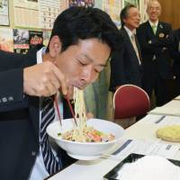 Local delicacy: A man slurps \"chanpon\" noodles made of locally grown wheat during a recent promotion held in the city of Nagasaki. | KYODO