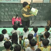 Building blocks: Fe Gulmatico teaches a preschool class at Sanayan ng Batang Nanambakan Center, a development center for former child scavengers, in Tondo, Manila. | ERDA