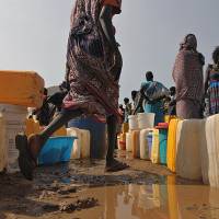 Displaced: South Sudanese who have fled ethnic fighting line up for water Saturday at the U.N. mission in South in Juba. Why world's newest country is nearing civil war