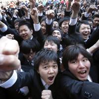 Searching for work: Vocational students raise their fists during a rally to kick off the job-hunting season in Tokyo in February. | BLOOMBERG