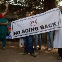Reversal: Indian activists hold a banner during a protest Wednesday in Mumbai over the Supreme Court ruling reinstating a ban on gay sex. Indian Supreme Court upholds anti-gay sex law