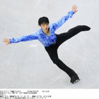Splendid start: Yuzuru Hanyu performs during the men\'s short program at the national championships on Saturday at Saitama Super Arena. Hanyu earned 103.10 points and holds a commanding lead. | KYODO