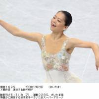 Career first: Akiko Suzuki grabs the title at the national championships on Monday at Saitama Super Arena, finishing first in the women\'s program with 215.18 points. | KYODO