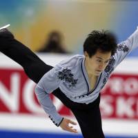 En route to silver: Canada\'s Patrick Chan competes during the free skating program at the Grand Prix Final on Friday in Fukuoka. | AP