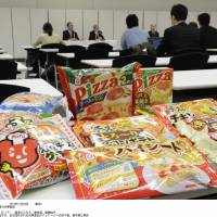 Under suspicion: Samples of frozen foods being recalled by Aqlifoods Co., a subsidiary of Maruha Nichiro Holdings Inc., are displayed at a press conference in Tokyo. | KYODO