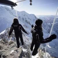 The Chamonix Skywalk, a five-sided glass room on the top tier of the 3,842-meter Aiguille du Midi peak in the French Alps, is unveiled to the press Tuesday. The new attraction will be opened to the public on Saturday. | REUTERS/KYODO