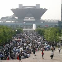 Festival atmosphere: Hordes of manga fans line up to attend Comiket at Tokyo Big Sight. One of the many attractions at the event is the cosplay area, where girls  and boys dress up as anime characters.  | COMIC MARKET COMMITTEE