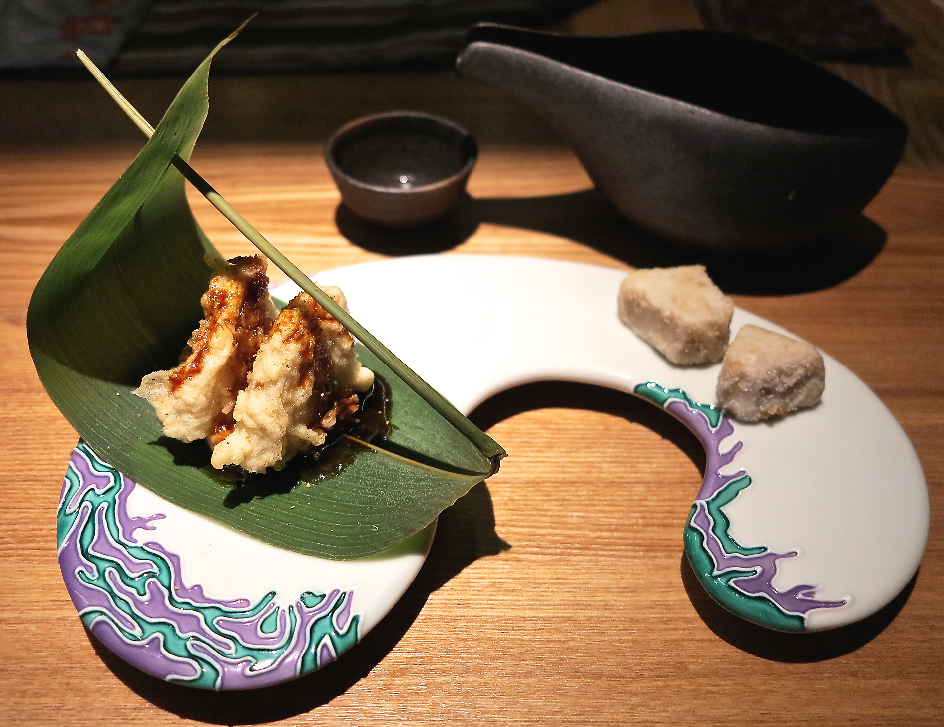 Psychedelicious: GiroGiro's playful spirit is evident in its new Tokyo branch, with unusual dishes including foie gras and battered lotus root on a bamboo-grass leaf. | ROBBIE SWINNERTON