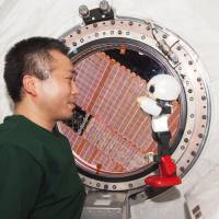 Prime time: Koichi Wakata and Kirobo hold the first-ever human-robot conversation in space, aboard the International Space Station last December. Cooperation vs. competition in space