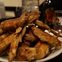 On the wing: Tebasaki (chicken wings) are a Nagoya favorite that has spread across Japan, thanks in part to the popularity of the Yamachan chain. | ADAM MILLER
