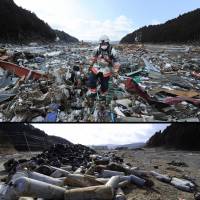Once beyond imagination, yet now familiar: A rescue worker walks through detritus in the tsunami-hit town of Minamisanriku, Miyagi Prefecture, on March 18, 2011. | AFP-JIJI