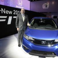 Best Fit: John Mendel, executive vice president of auto sales with American Honda Motor Co., stands with the Honda Motor Co. 2015 Fit during the Detroit auto show Monday. | BLOOMBERG