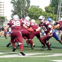 New look: The Deers, seen here wearing their old colors in a game against IBM BigBlue in April last year, will now be known as the Lixil Deers and will play in orange and white. | KAZ NAGATSUKA